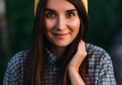 Portrait of a traveler girl in a yellow cap. Portrait of a female tourist Portrait of a traveler girl in a yellow cap. Portrait of a female tourist